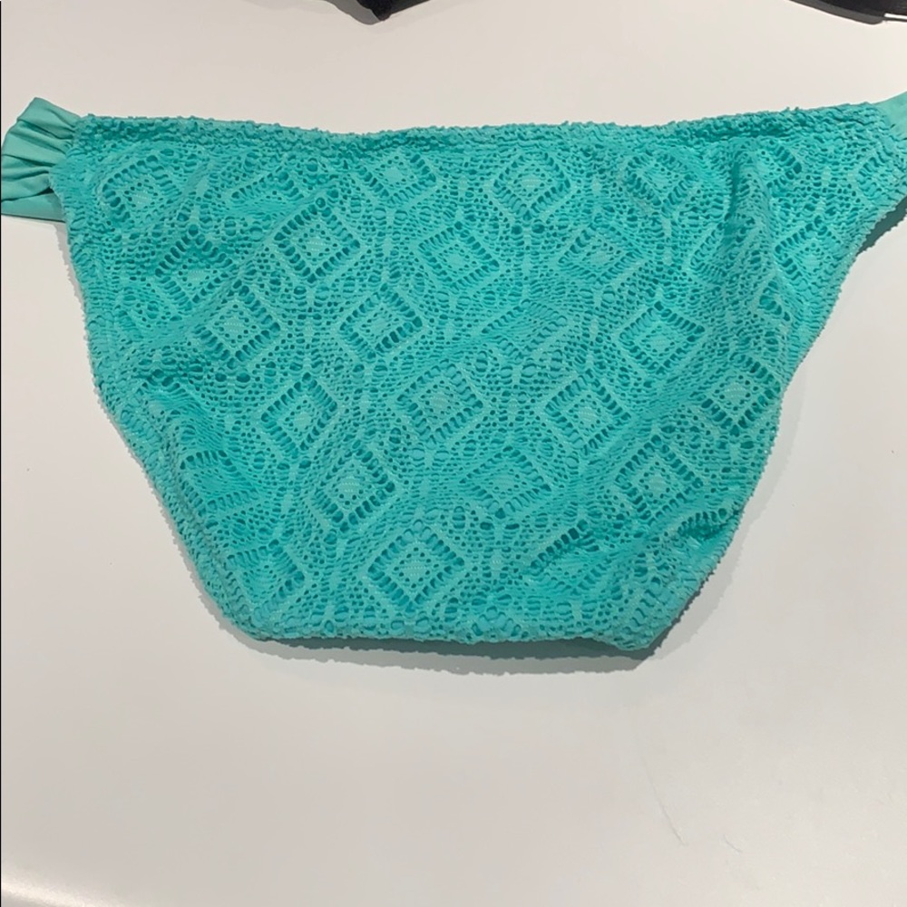 Turquoise/teal bathing suit. Good condition-used